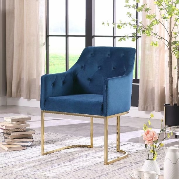 Blue velvet accent chair with gold base