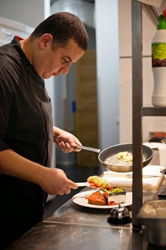 A man cooking in a restaurant kitchen