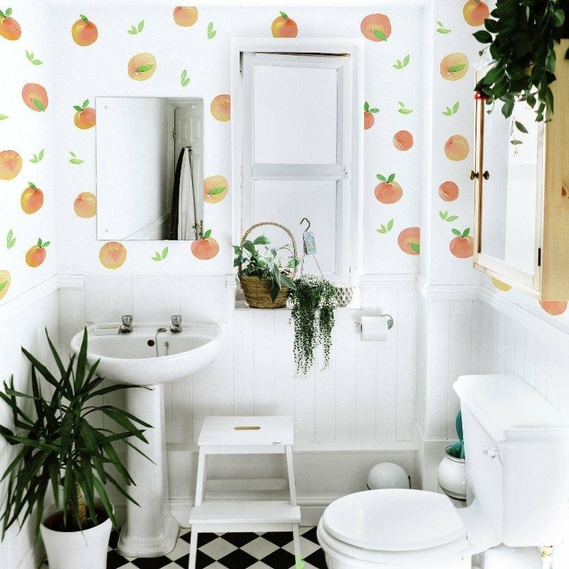 the peach wall decals in a bathroom