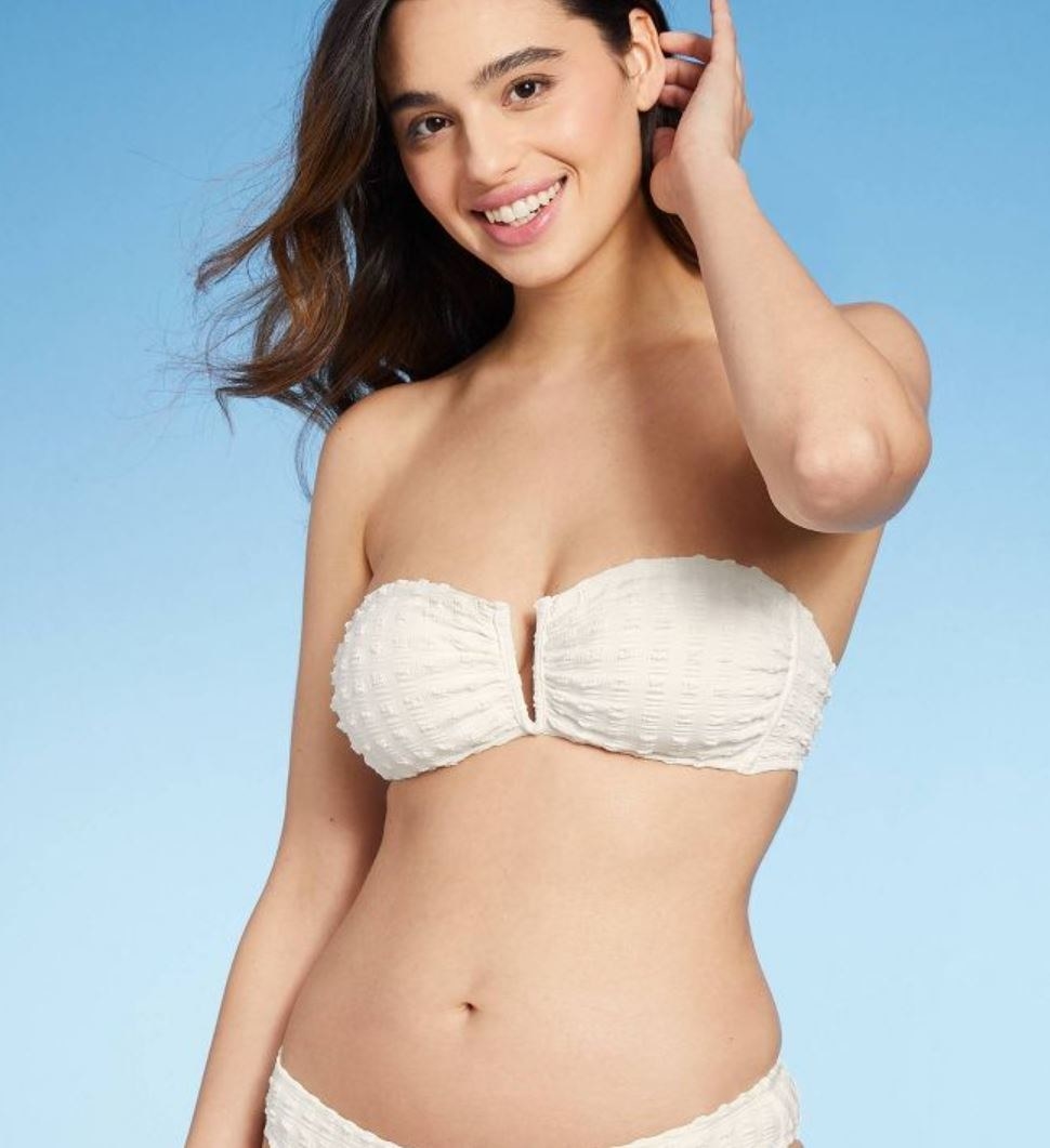 model wearing white strapless bikini