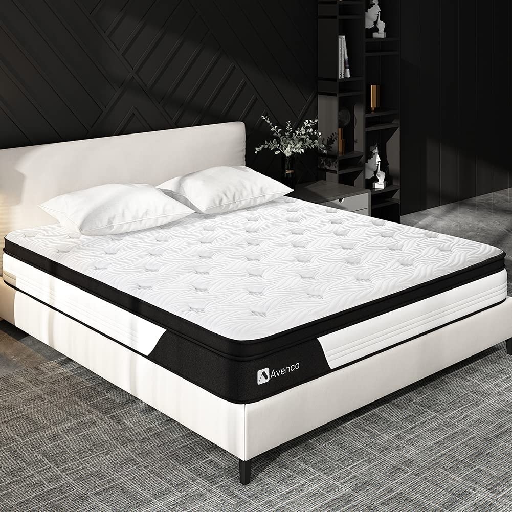 the cooling mattress on a bed frame with two pillows