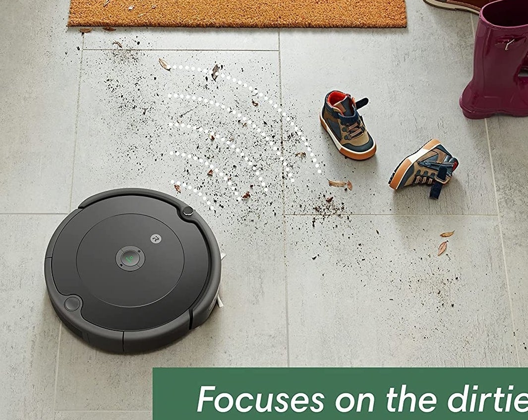 the robot vacuum cleaning dirt in the front entryway