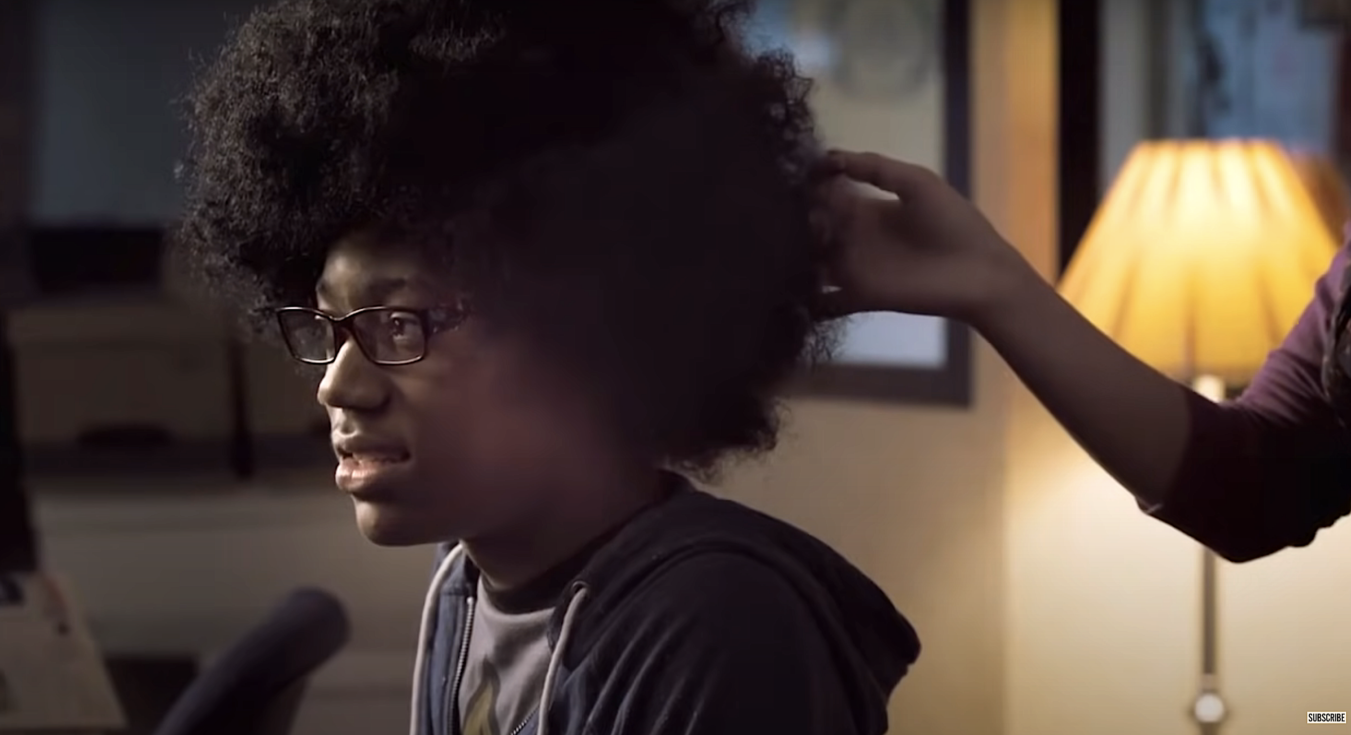 Someone touches young man&#x27;s afro