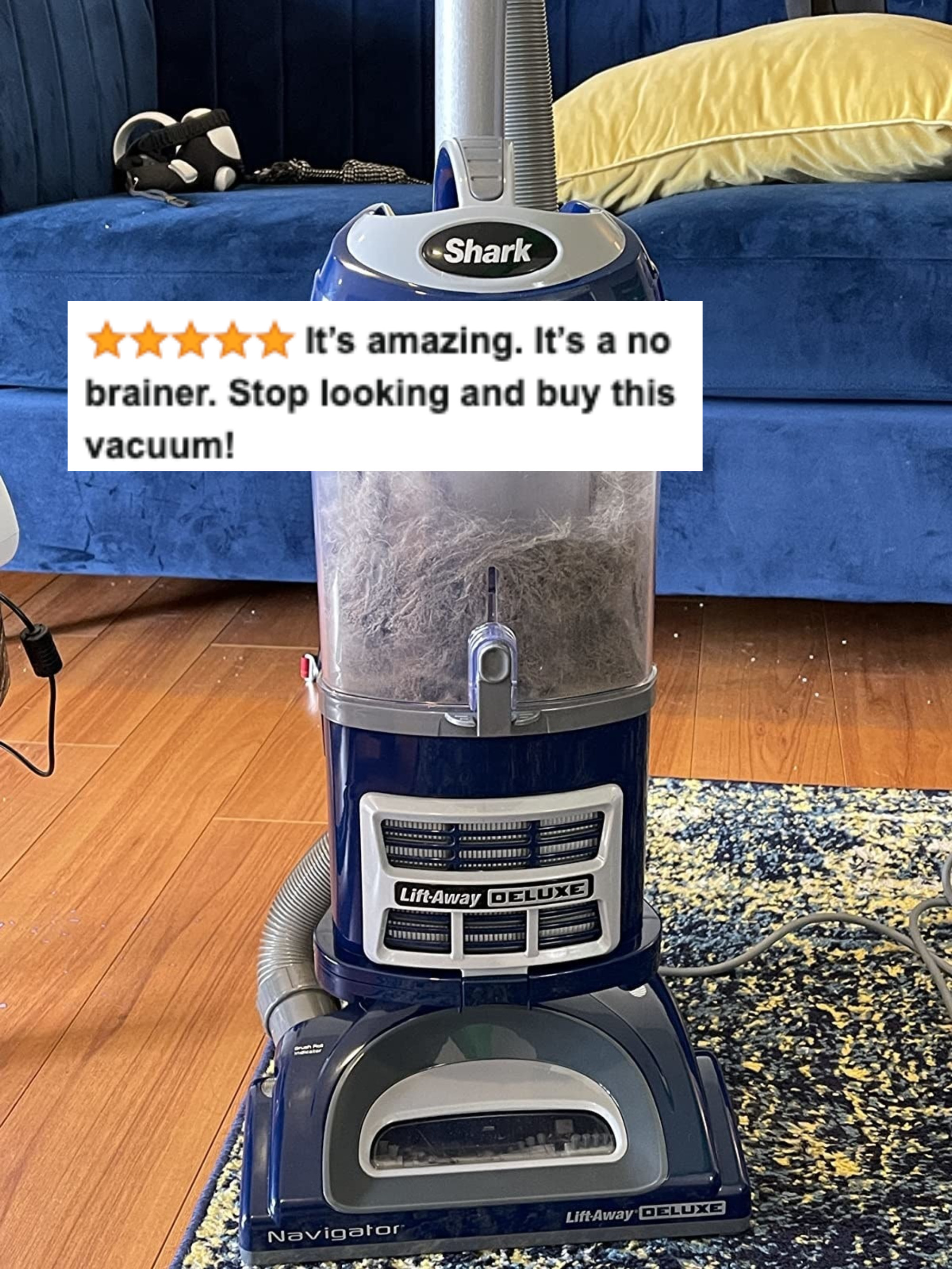 A reviewer's image of the dust-filled vacuum with five star review text saying it's amazing it's a no brainer stop looking and buy this vacuum