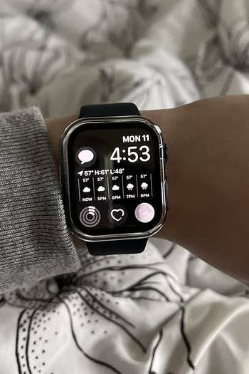 the apple watch displaying weather and time