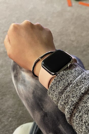 the apple watch on a wrist, screen off