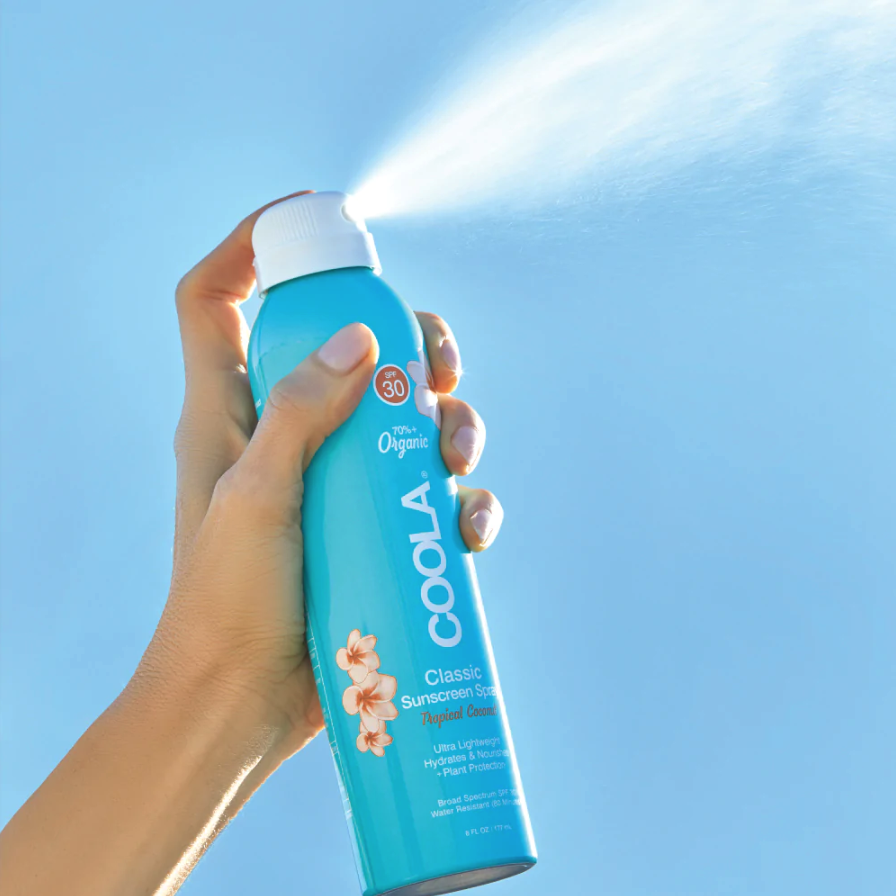 spray bottle of coola sunscreen