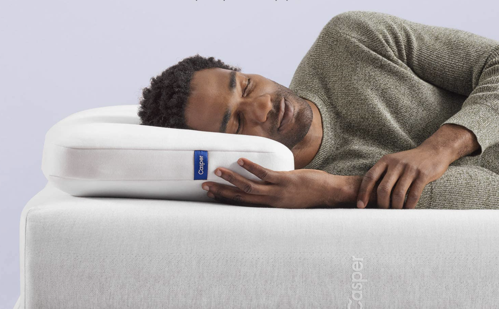 Model sleeping on a white pillow