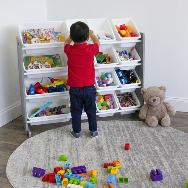 a child taking toys out of a toy organizer