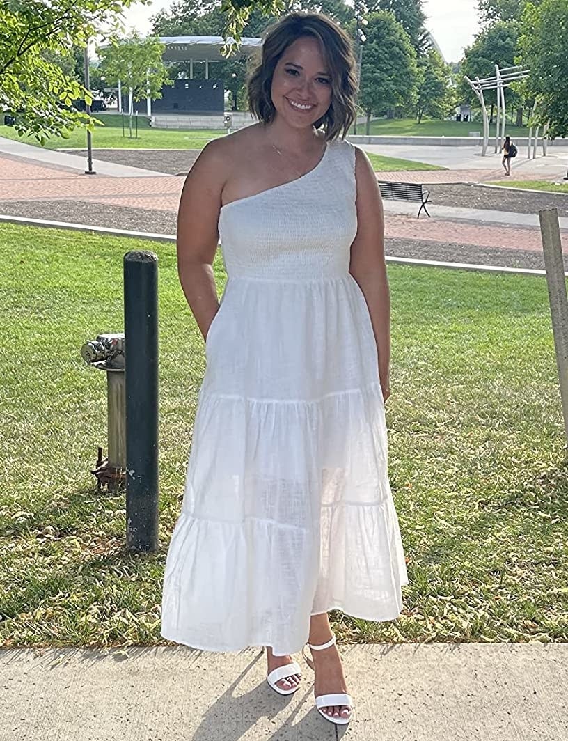reviewer wearing the white dress