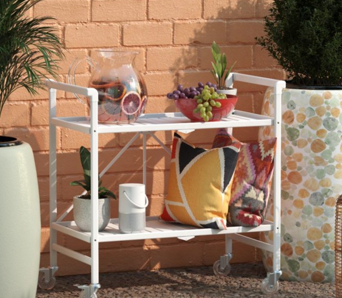 the white serving cart out on a patio