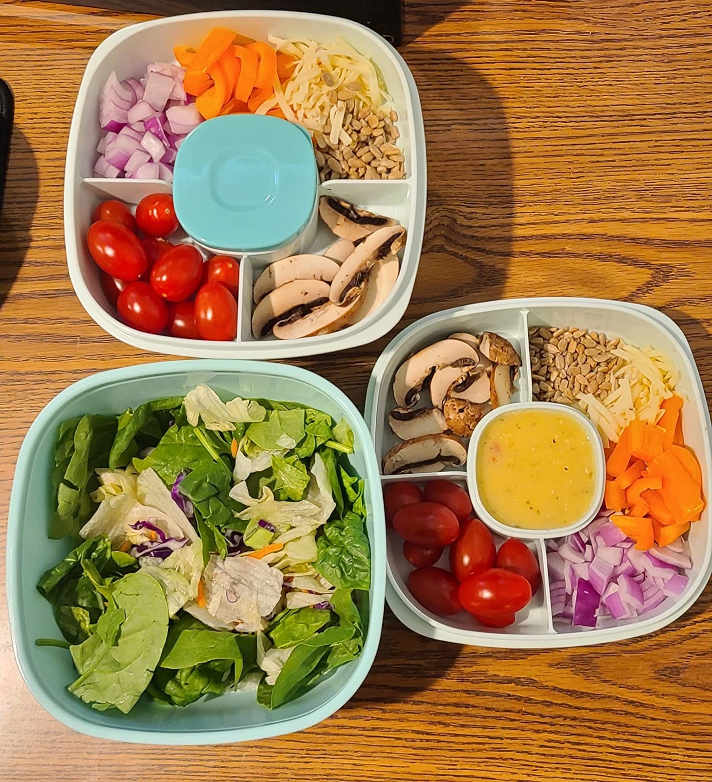 Reviewer image of stackable lunch box filled with salad ingredients