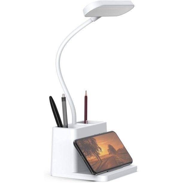 A USB LED desk lamp with a pencil and phone holder