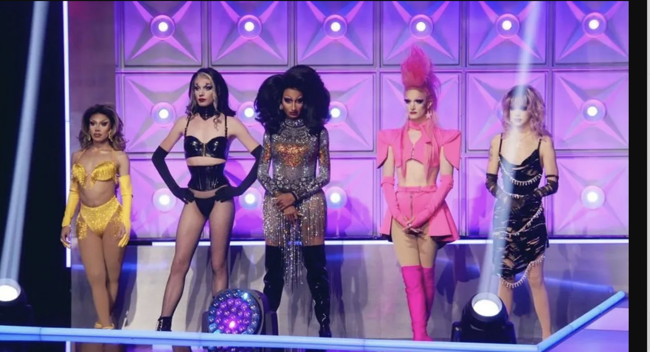 Five queens stand on the stage