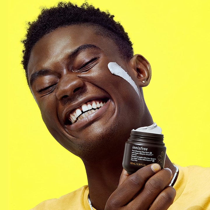 Model holding jar of Innisfree face mask