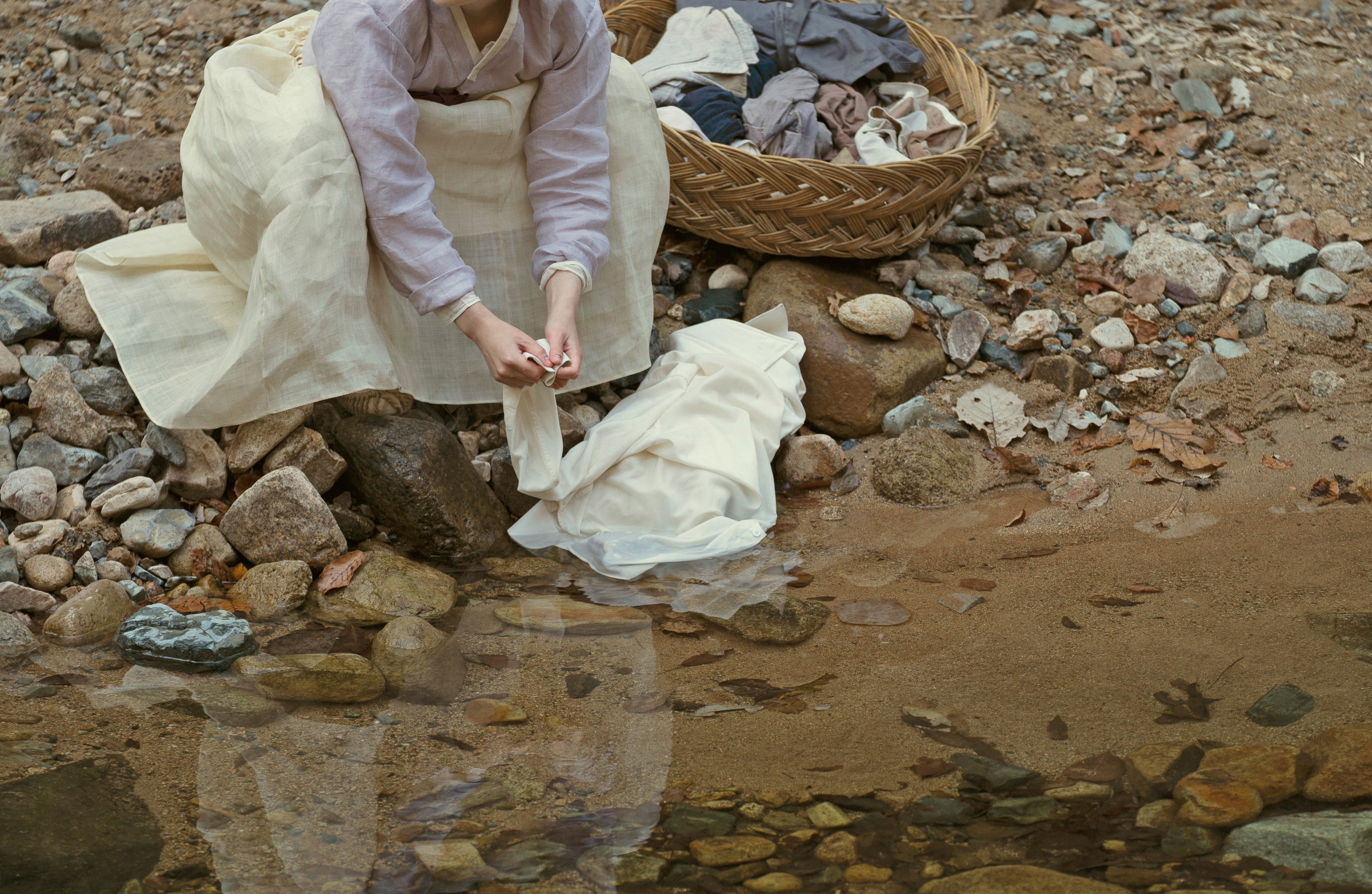 Kim Min-ha does laundry in a river