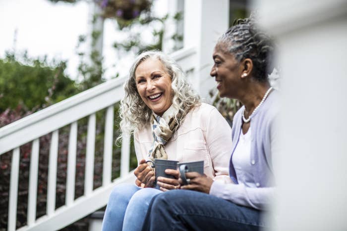 neighbor ladies having coffee and chatting on the porch