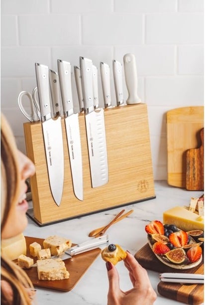 a fourteen-piece magnetic knife block holding knives and kitchen sheers