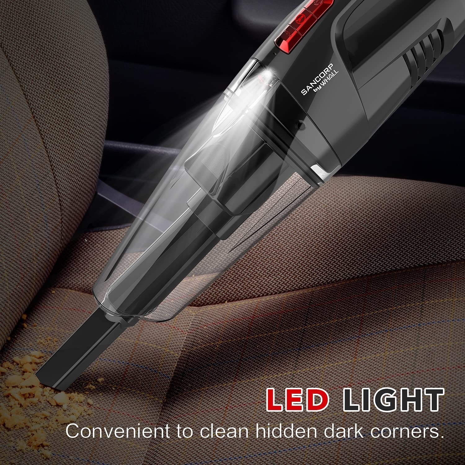 cordless vacuum picking up crumbs in a car