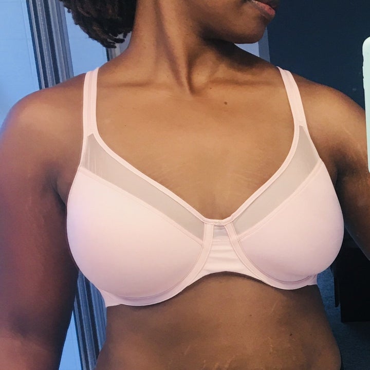 reviewer wearing the light pink bra