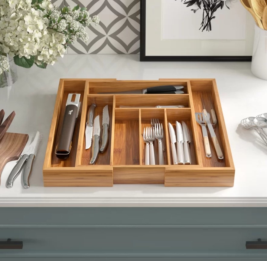 wooden utensil tray on countertop