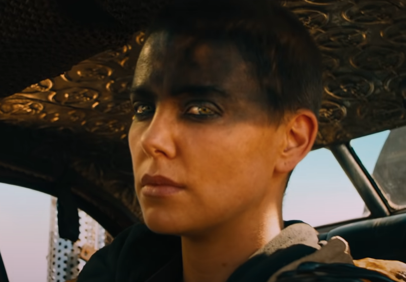 Close-up of Charlize Theron as Furiosa in a car