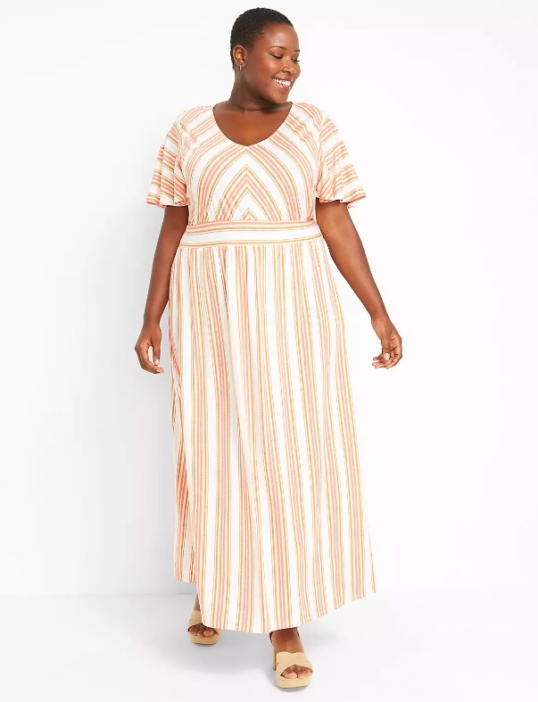 Model wearing striped maxi dress and wedges