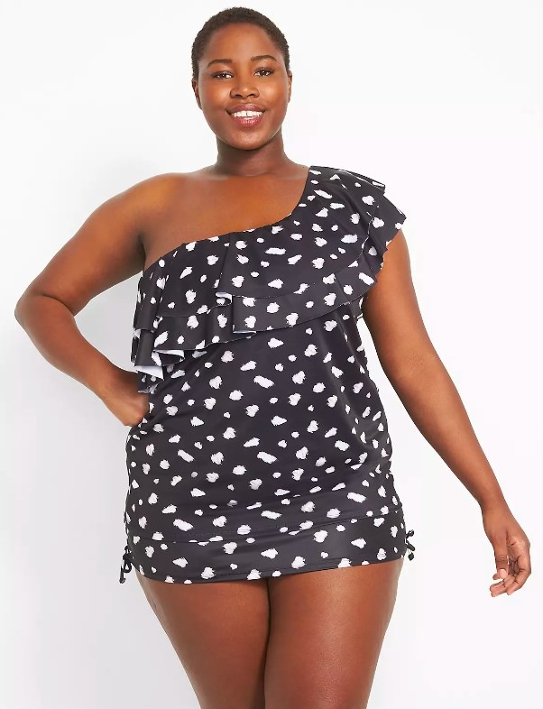 Model wearing black and white swimsuit