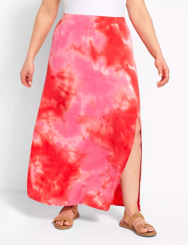 Model wearing tie-dye skirt and brown sandals