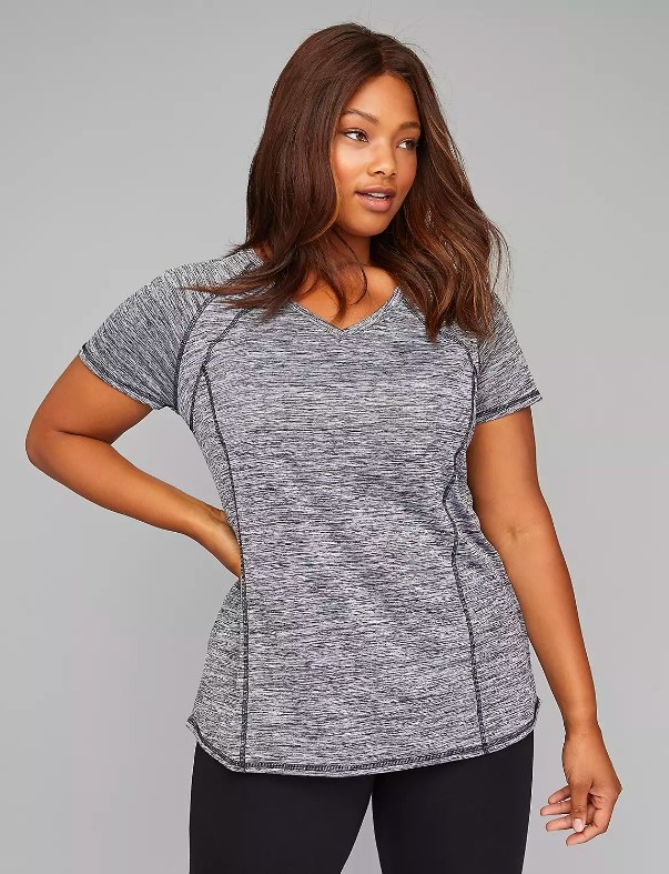 Model wearing gray workout tee and black leggings