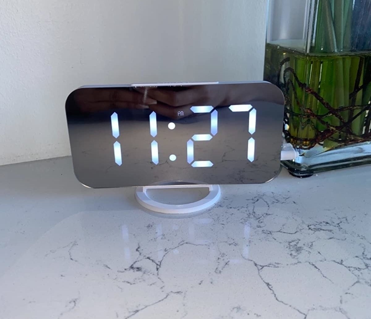 Reviewer alarm clock on marble table