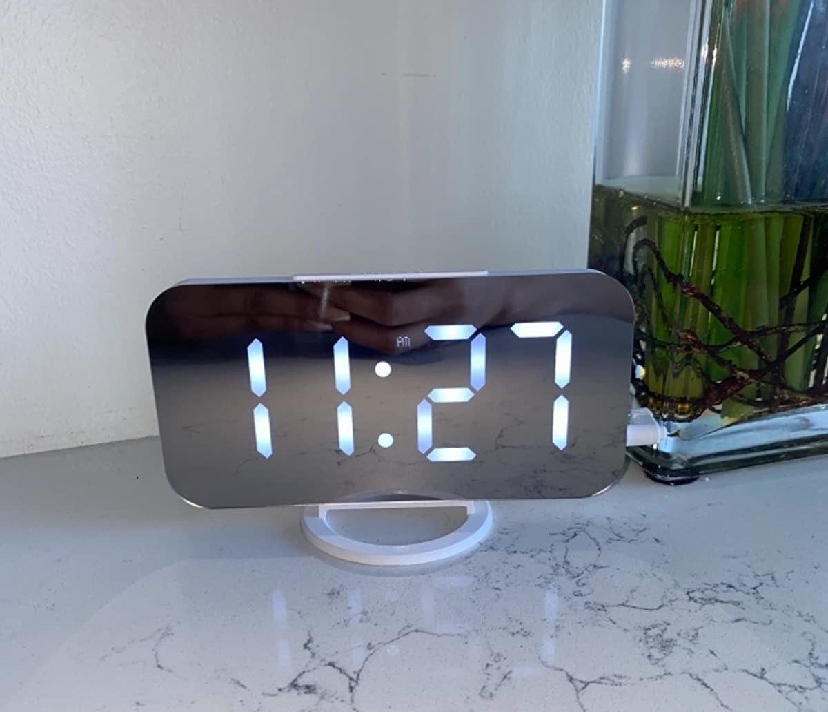 Reviewer alarm clock on marble table