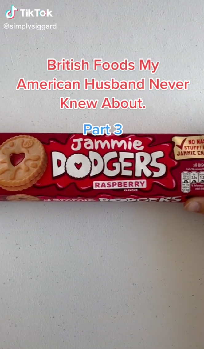 Caroline holding up a package of Jammie Dodgers, which is a British brand of cookie
