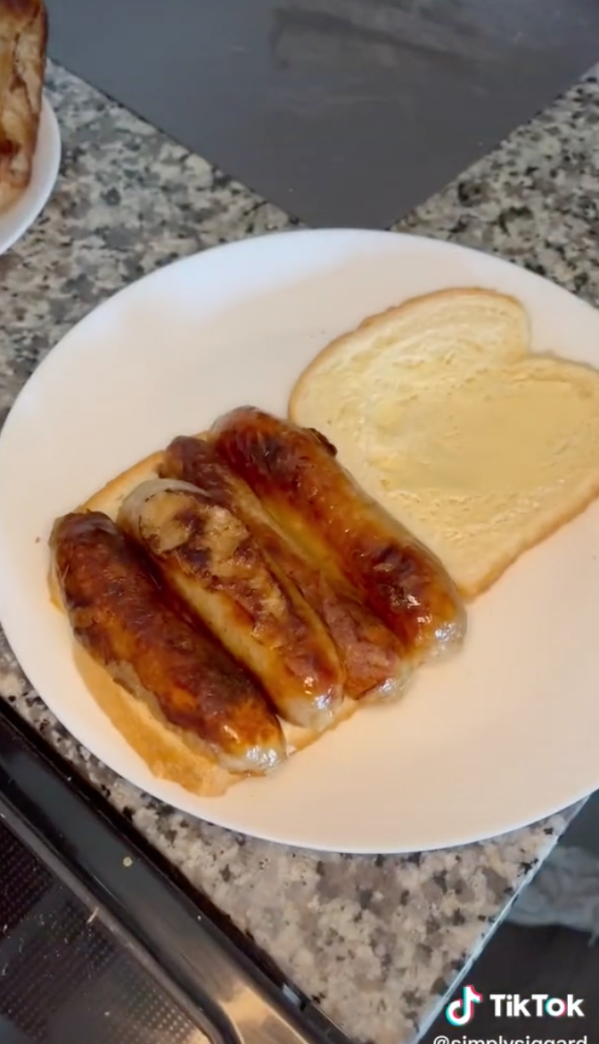 Strips of sausage sitting on one piece of bread, while another piece of bread coated in HP sauce waits to be put on top
