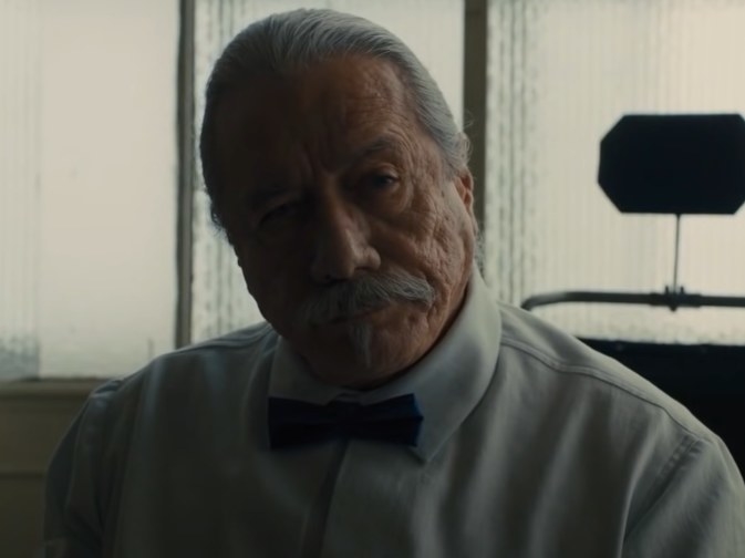 Edward James Olmos wearing a white shirt and bowtie in Blade Runner 2049