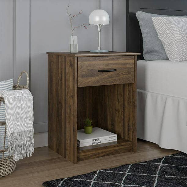 The nightstand next to a bed