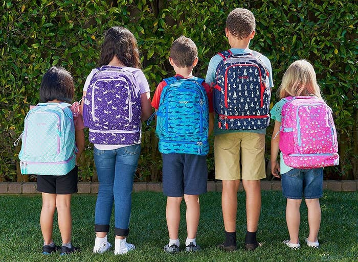 kids wearing backpacks in different styles