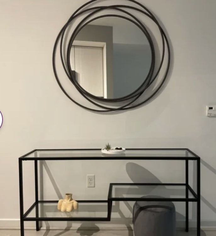 A round wall mirror