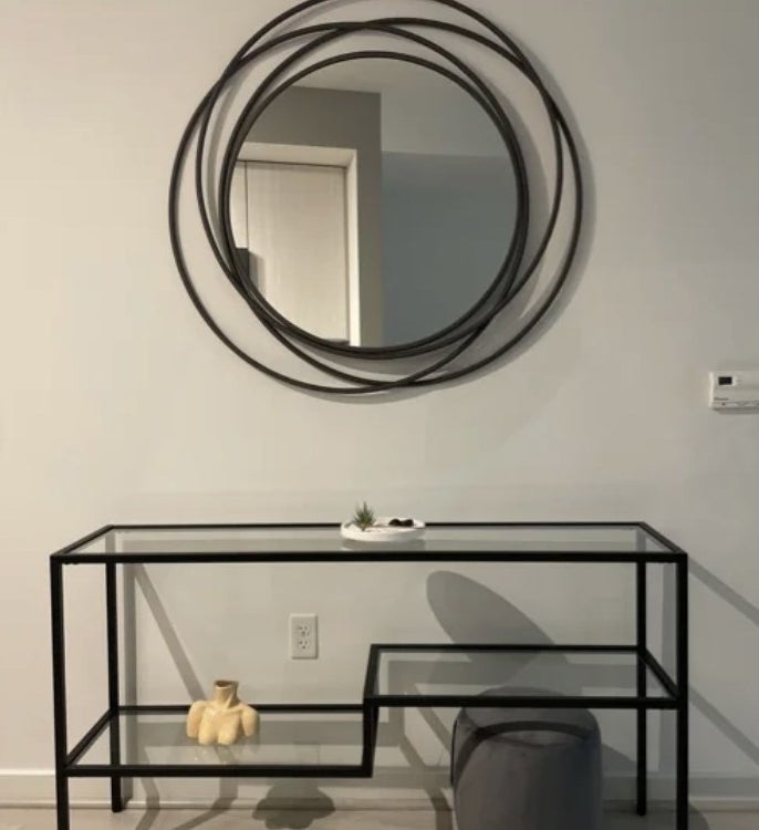 A round wall mirror