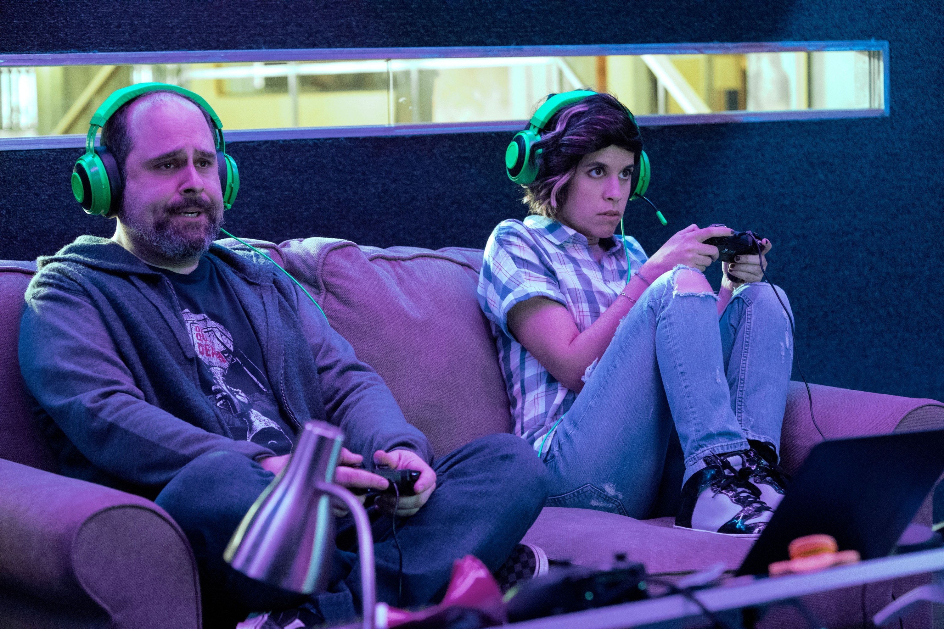 A man and woman playing a video game