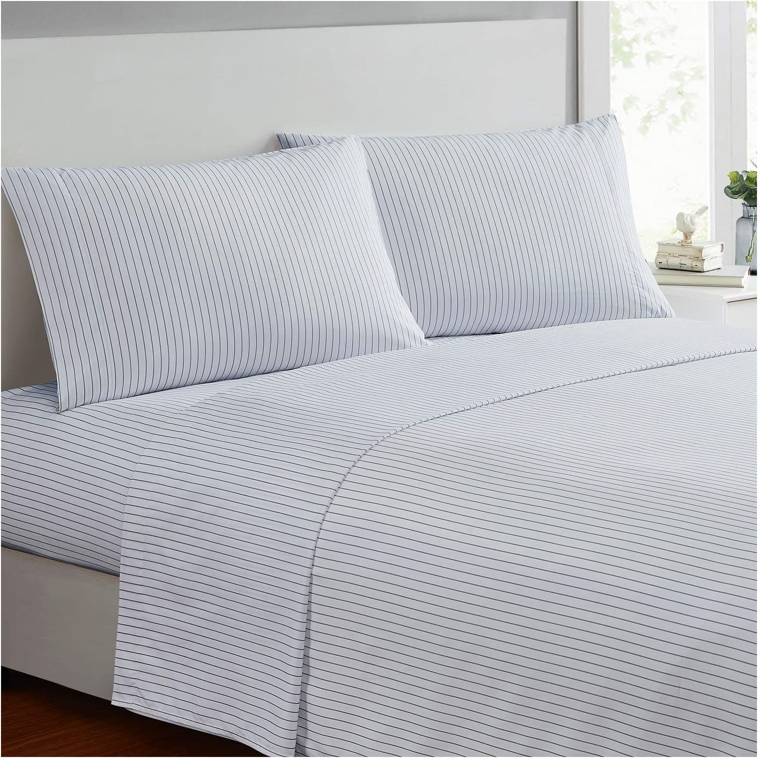 the sheets in white with thin navy stripes