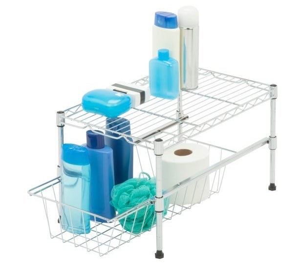 a white under cabinet baskets holding bathroom supplies