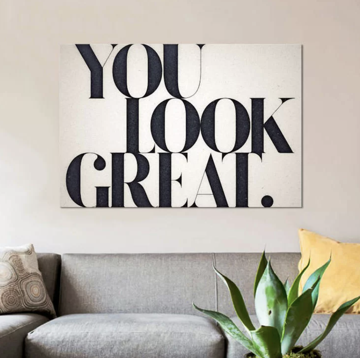 The white canvas wall print that reads "you look great" in big black lettering