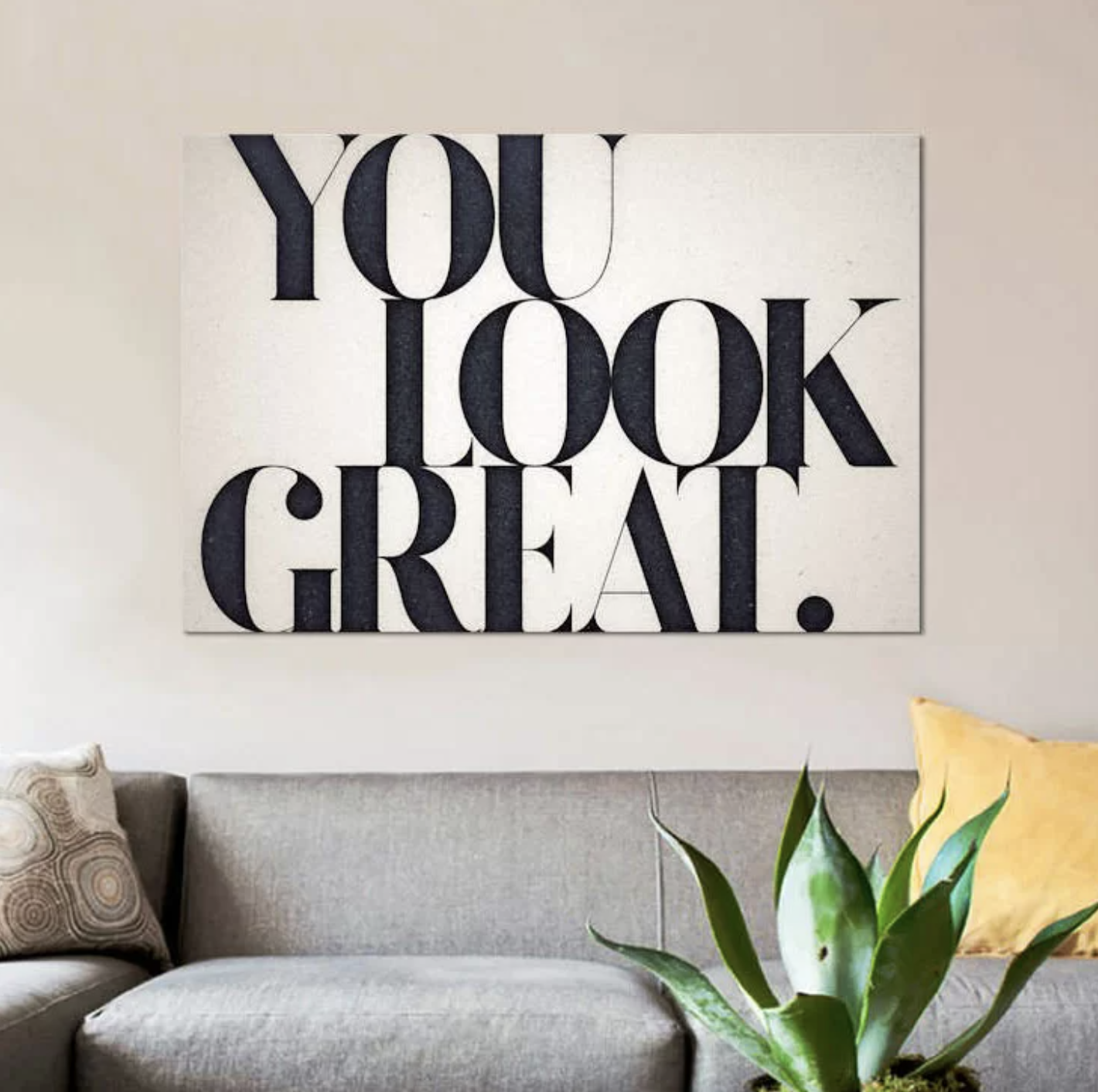 The white canvas wall print that reads &quot;you look great&quot; in big black lettering