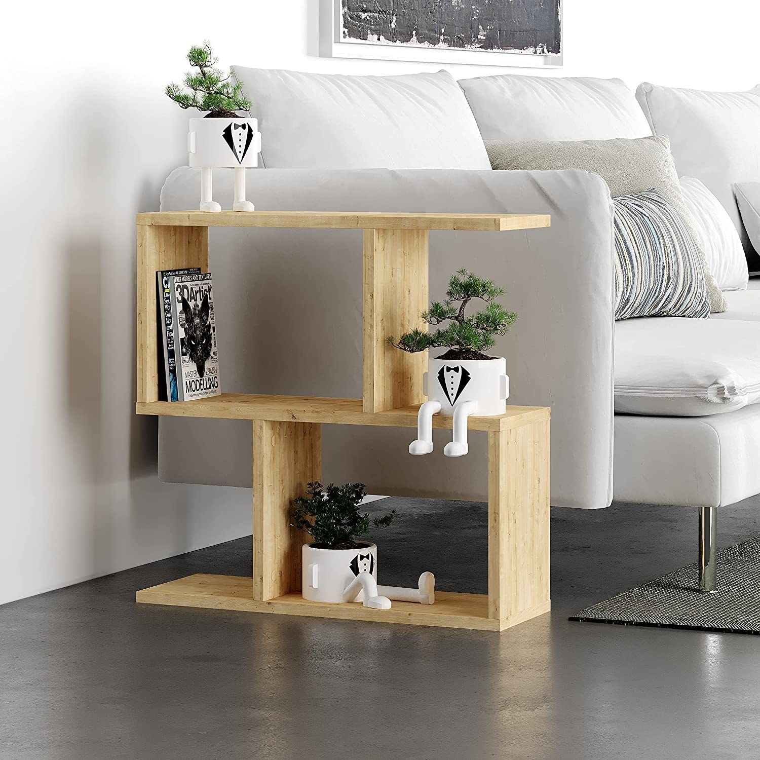 a petite side table in an irregular shape next to a sofa