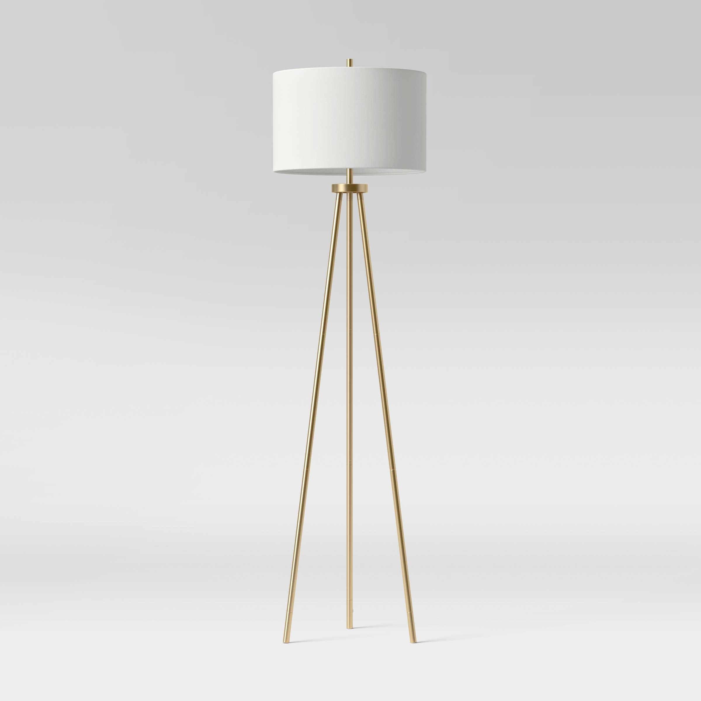 the gold floor lamp with a white shade