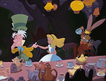 alice and the mad hatter running around the table