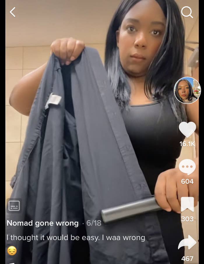 Natasha ironing her work shirt with a flatiron