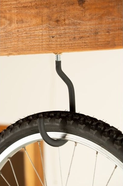 a black bike hook holding a bike tire