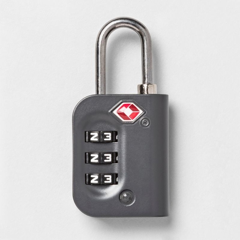 a luggage lock with three numbered turn wheels